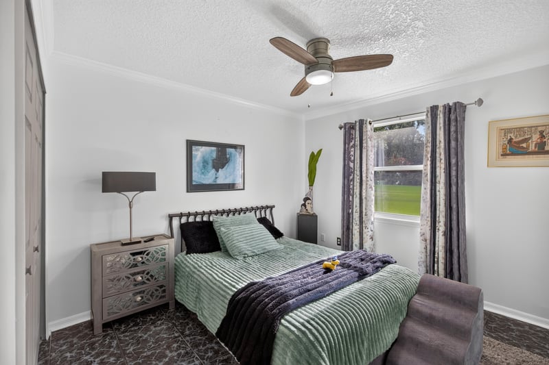 Bedroom with nightstand and window at 1346 Gately Ct, Jacksonville, FL 32225