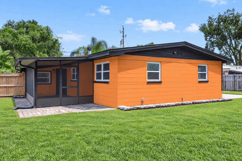 Back exterior with screened porch and black roofline at 4039 Habana Ave, Jacksonville, FL