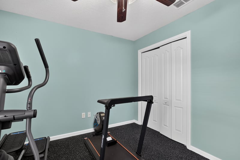 Home gym with treadmill and weights at 3112 Silverado Cir, Green Cove Springs, FL 32043