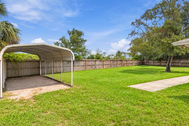 Backyard carport structure near fence line at 357 Dillon Dr, Orange Park, FL