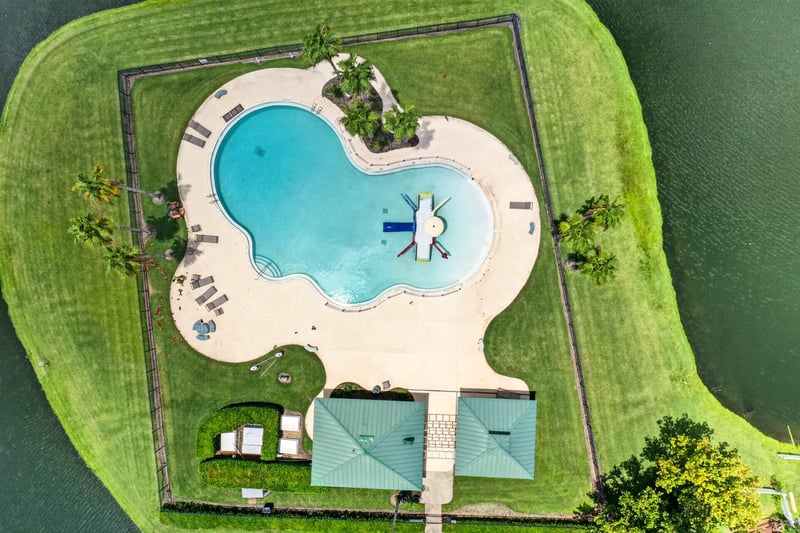 Aerial view of the community pool with loungers in Windsor Chase