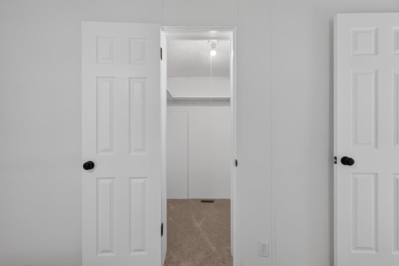 Closet and hallway with white doors at 55520 Jewel-Thomas Rd, Callahan, FL 32011