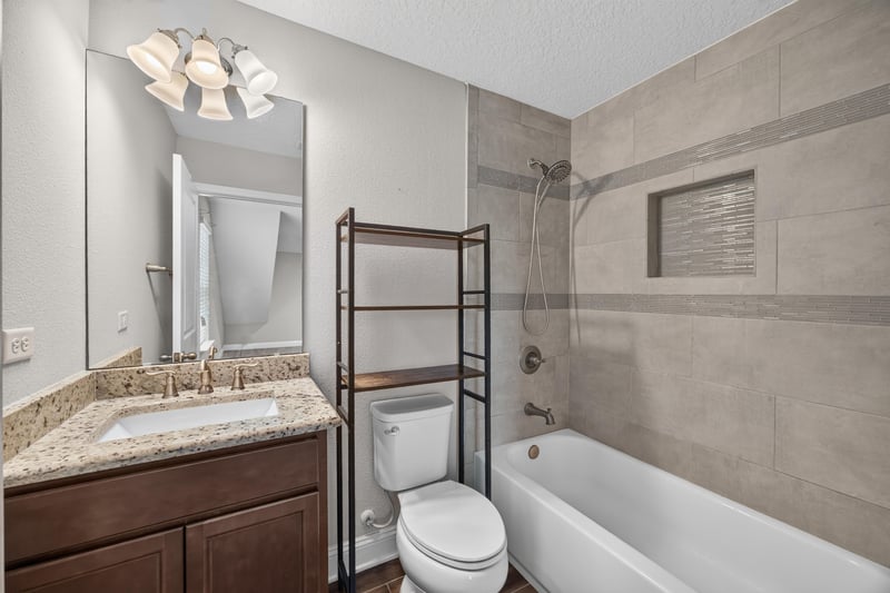 Bathroom with vanity, tub and open shelving at 53 Lumen Ct, St. Augustine, FL 32095