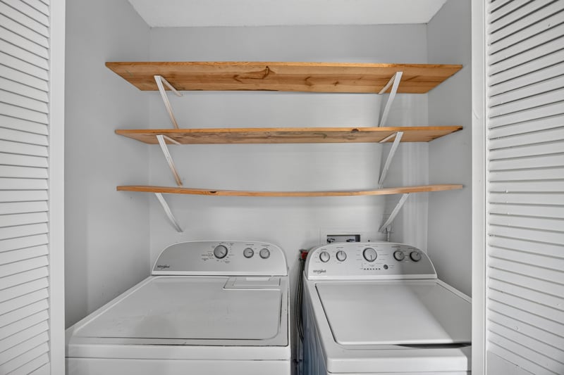 Laundry area with wood shelving, photographed by Megapixeler on Apple Oak Ct, Jacksonville