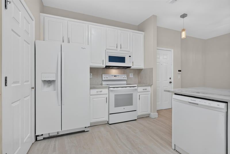 Kitchen appliances and cabinetry at 11251 Campfield Dr unit 1202, Jacksonville, FL 32256