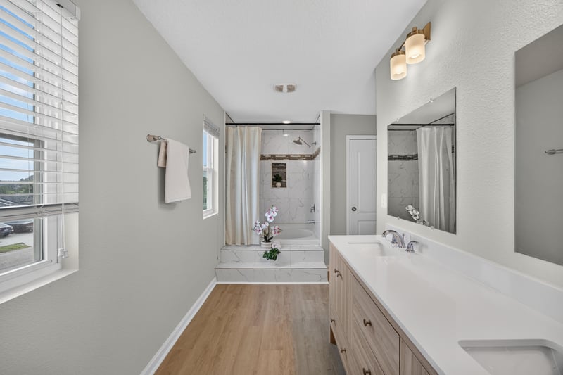 Primary bathroom with separate shower and dual vanity at 6830 Hanford St, Jacksonville, FL 32219