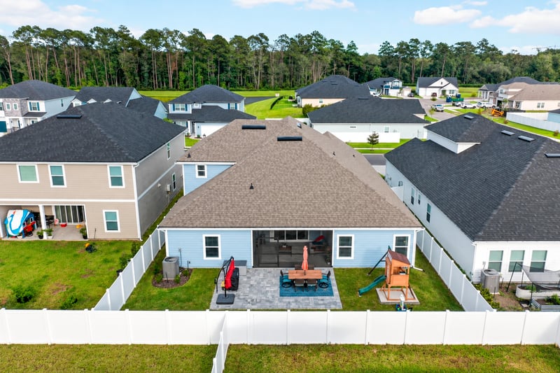 Aerial view of the backyard patio and fenced lot at 2354 Jennings Farm Dr, Middleburg, FL 32068