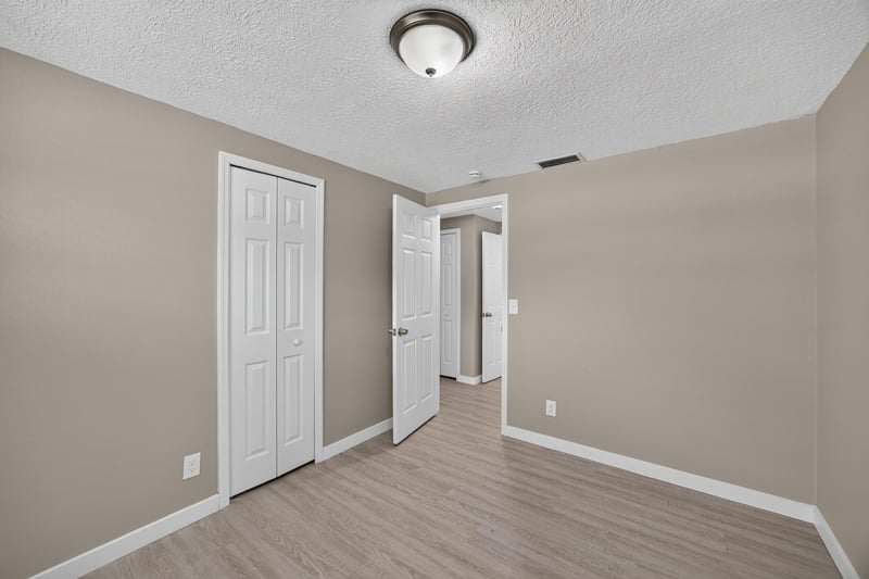 Hallway with doors to adjoining rooms at 184 Draco St, Orange Park, FL 32073