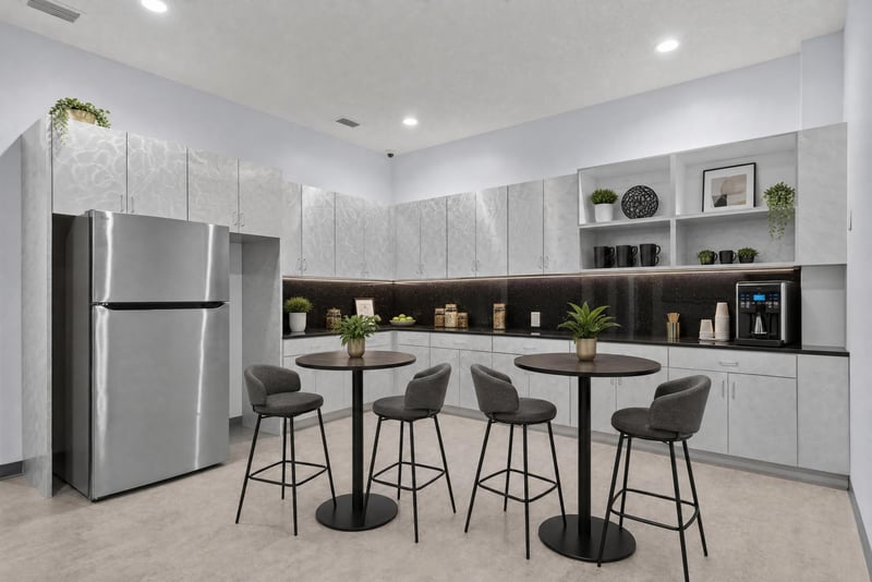 Furnished breakroom with high-top tables and stool seating at 7240 Golden Wings Rd building 100, Jacksonville, FL 32244