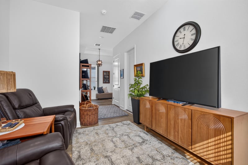 Living room with media console and area rug at 129 Amberwood Dr, St. Augustine, FL