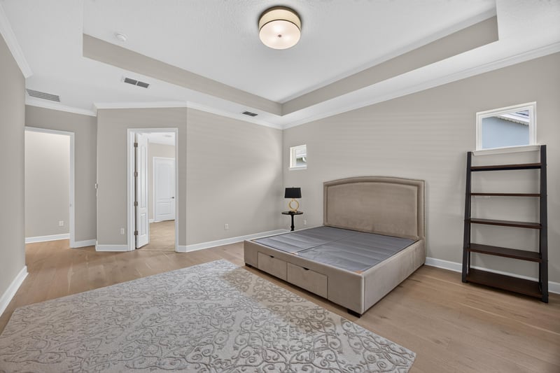 Bedroom with tray ceiling and bookshelf at 276 Cross Ridge Dr, Ponte Vedra Beach, FL 32081