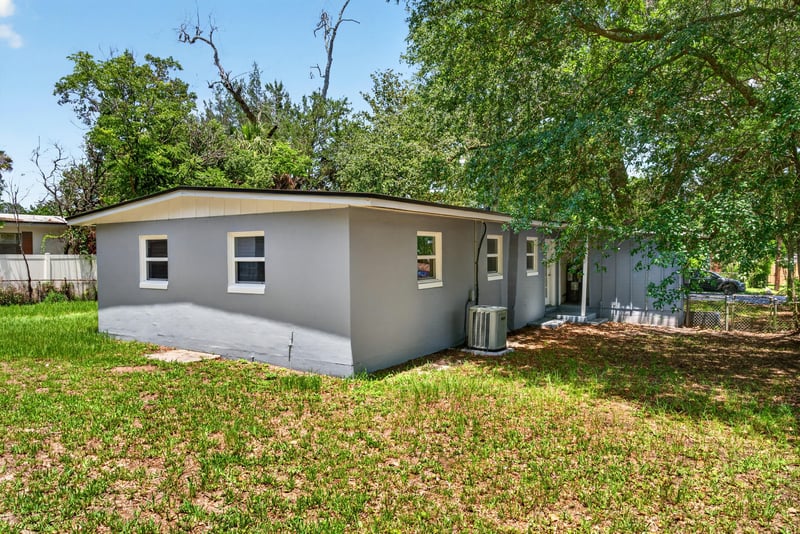 Backyard view with carport at 1928 Montmarte Dr, Jacksonville, FL 32210