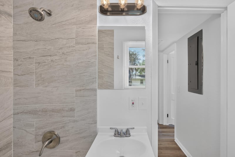 Bathroom sink and tile surround at 855 Cornwallis Dr, Jacksonville, FL