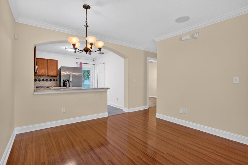 Open floor plan with archway and hardwood floors at 353 Redwood Ln