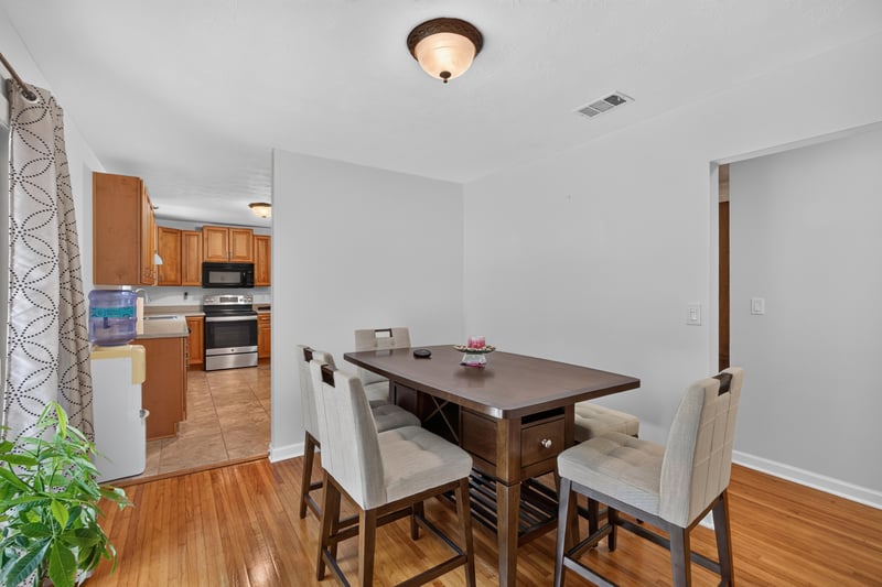 Dining and kitchen combo with table and cabinets at 1847 Grove Park Dr, Orange Park, FL