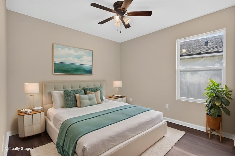 Bedroom virtually staged with bed and artwork at 7253 Townsend Village Ct, Jacksonville, FL