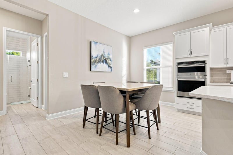 Breakfast nook with wood table and pendant lighting at 27 Holly Rdg Wy, St. Augustine, FL