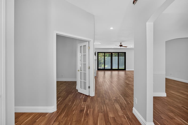 Entry hall with wood floors leading into the home at 11675 Magnolia Estates Rd, Jacksonville, FL 32223