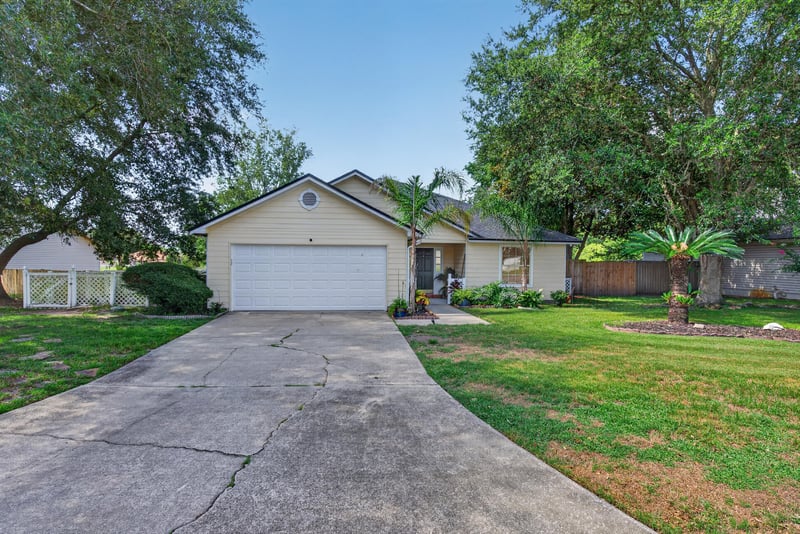 Front exterior with driveway view at 8680 Bandera Cir S, Jacksonville, FL 32244