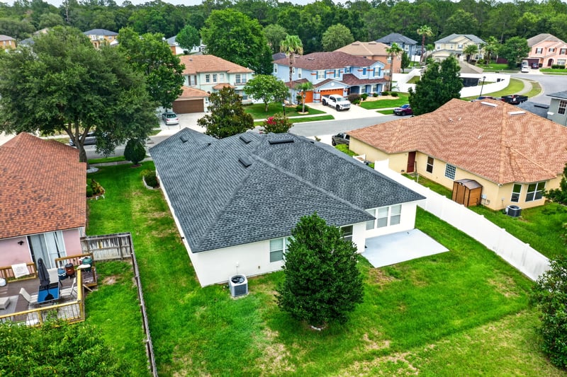 Aerial view of backyard and surrounding rooftops in Adams Lake, Jacksonville, FL