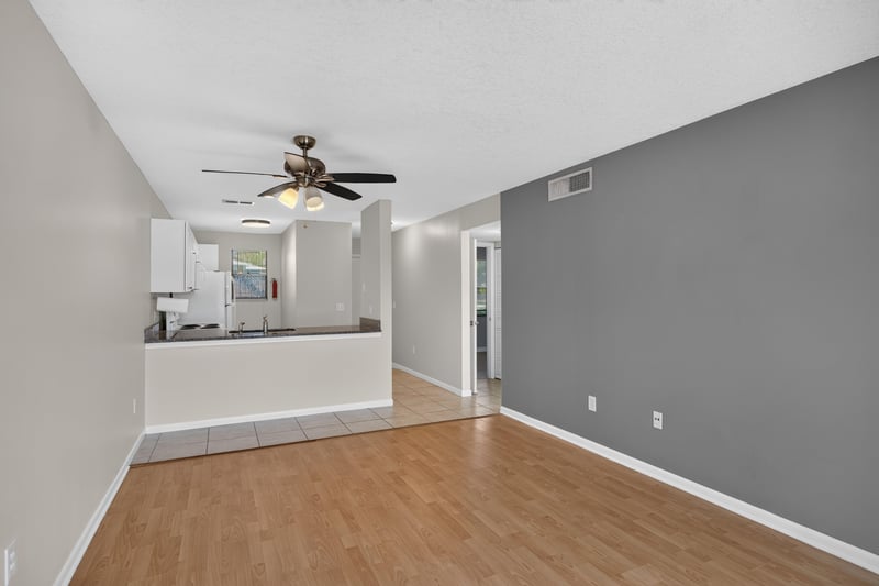 Living room with pass-through to kitchen at 700 W Pope Rd unit h61, St. Augustine, FL 32080