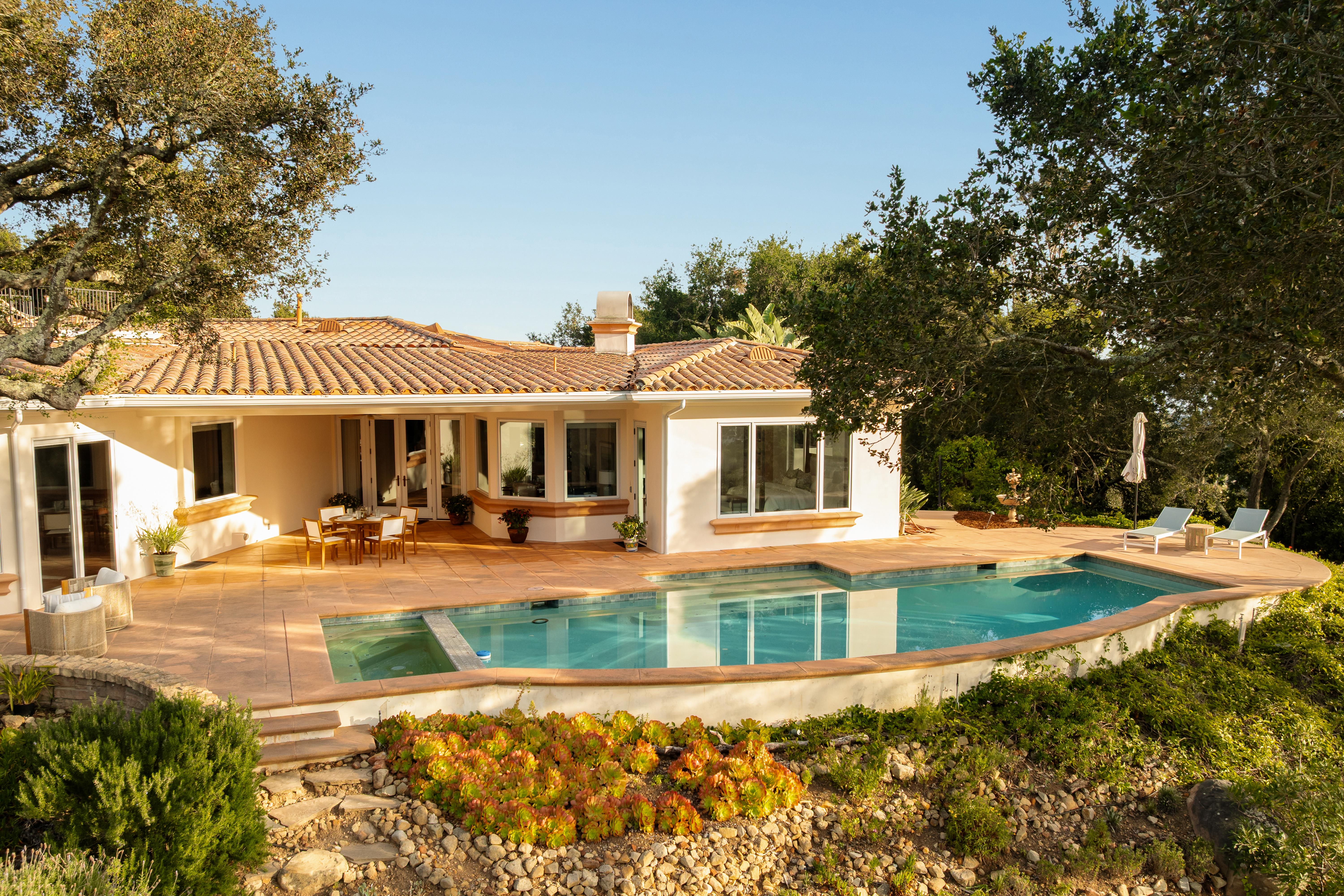 Exterior facade of luxury estate at 450 El Cielito Rd, Santa Barbara — professional real estate photography showcasing Santa Ynez Mountain views and architectural detail along the Santa Barbara Riviera. Our team captured still photography, aerial drone photography, twilight photography, a Matterport virtual tour, a 2D floor plan, and a custom property website from afternoon through twilight.