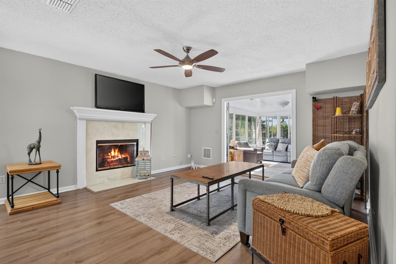 Living room with fireplace and sofa at 8680 Bandera Cir S, Jacksonville, FL 32244