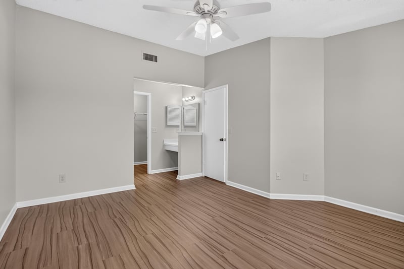 Bedroom with ceiling fan and closet at 8010 International Village Dr, Jacksonville, FL 32277