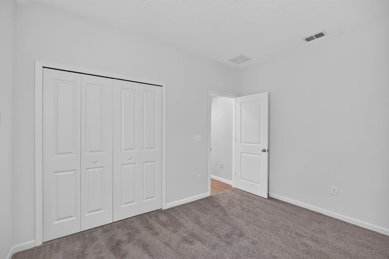 Closet with double doors and hallway at 9905 Ansley Lake Dr, Jacksonville, FL