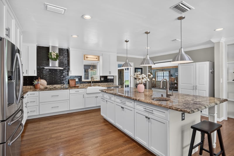 Kitchen view toward cabinetry and wood flooring at 5843 Ovella Rd, Jacksonville, FL 32244