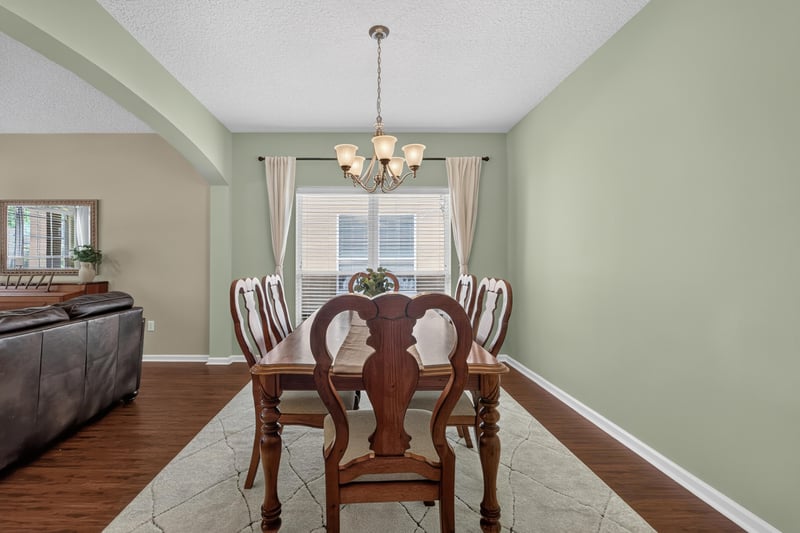 Dining room with chandelier and wood floors at 3660 Middlebrook Dr, Orange Park, FL 32065