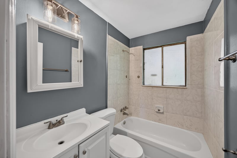 Bathroom with tub-shower combo and vanity at 6745 Jack Horner Ln, Jacksonville, FL 32210