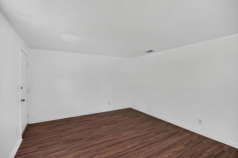 Empty room corner with wood-look flooring at 5812 Tampico Rd, Jacksonville, FL 32244