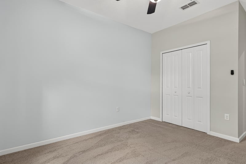 Carpeted room with closet door at 2378 Caney Oaks Dr, Jacksonville, FL