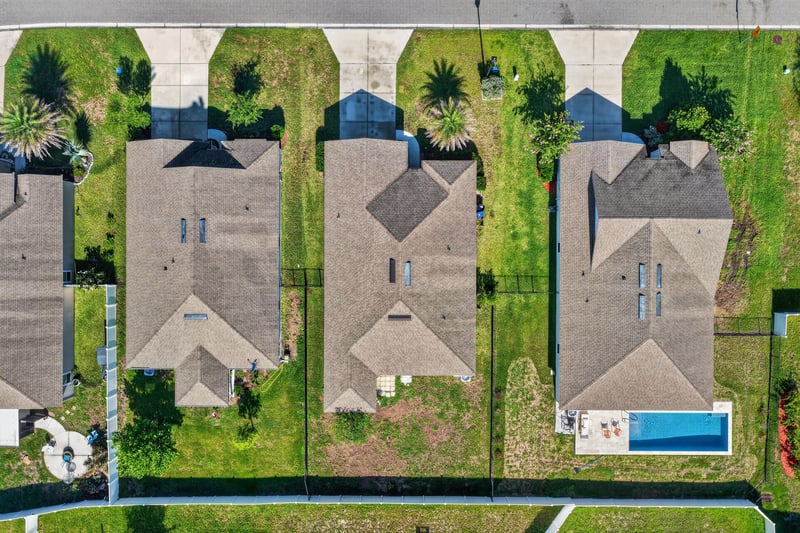 Aerial view of fenced yard and neighboring homes at 589 Seville Pkwy, St. Augustine, FL