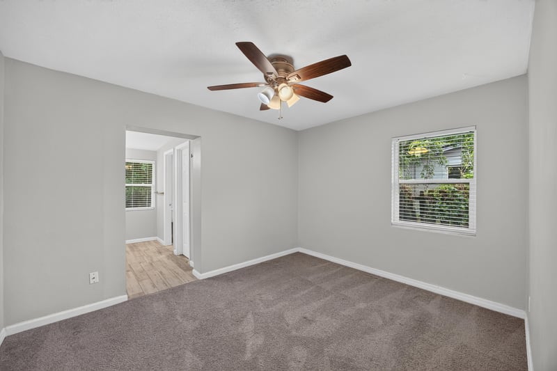 Bedroom, carpet and ceiling fan at 2256 Inwood Cir S, Jacksonville, FL