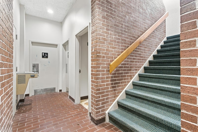 Stairwell with handrail and tile flooring at 101 Scholars Wy