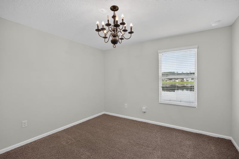 Bedroom with chandelier and carpet at 6830 Hanford St, Jacksonville, FL 32219