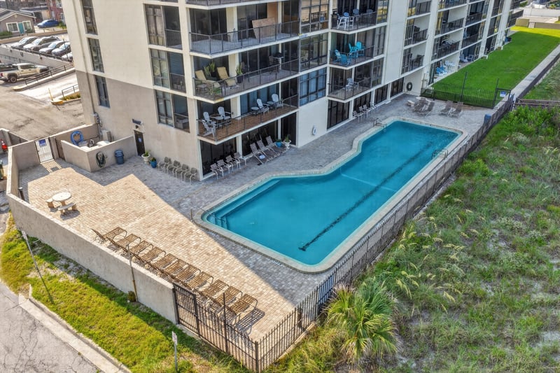 Aerial view of the ground-level pool and patio at 1301 1st St S