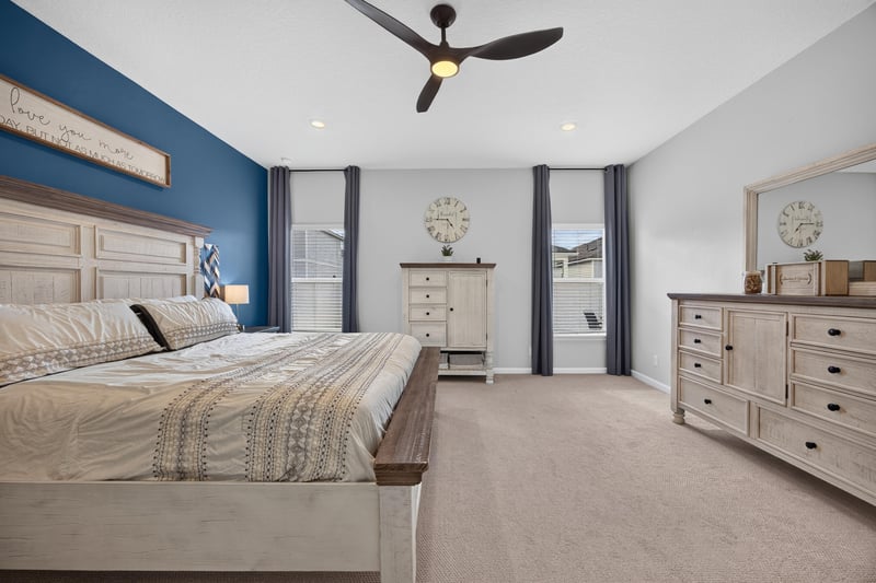 Bedroom with wood bed frame and window at 2354 Jennings Farm Dr, Middleburg, FL 32068