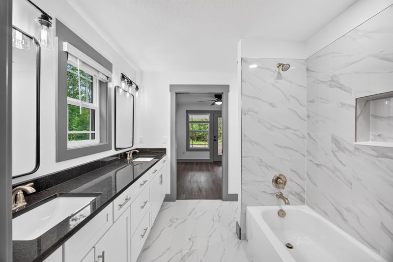Bathroom with soaking tub and vanity at 4800 Acacia St, Middleburg, FL 32068