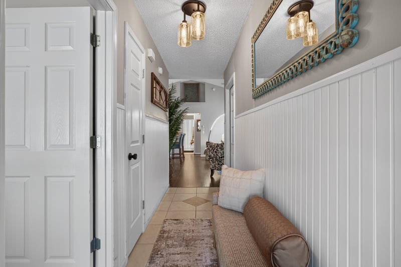 Entry hallway with wood-look tile flooring at 3067 Wavering Ln, Middleburg, FL 32068