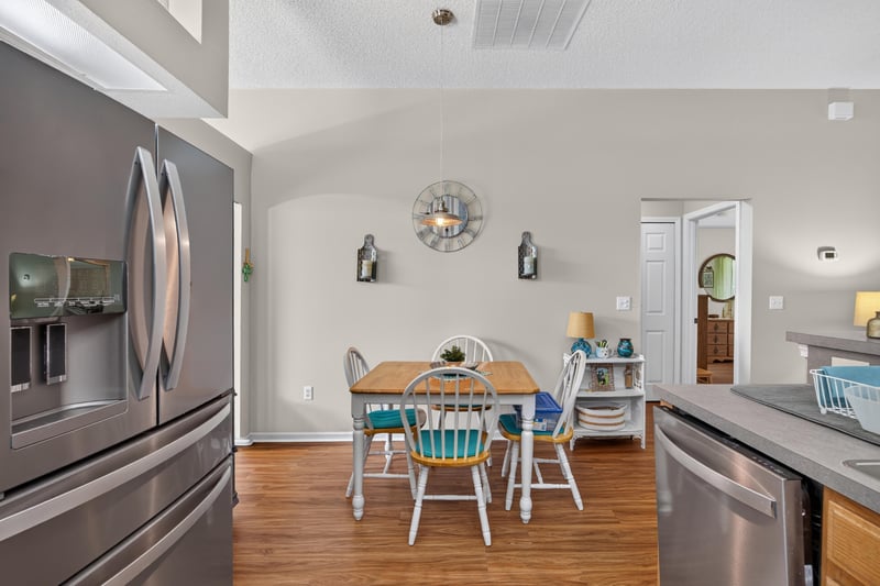 Kitchen with stainless refrigerator and breakfast table at 13514 Las Brisas Way N, Jacksonville, FL