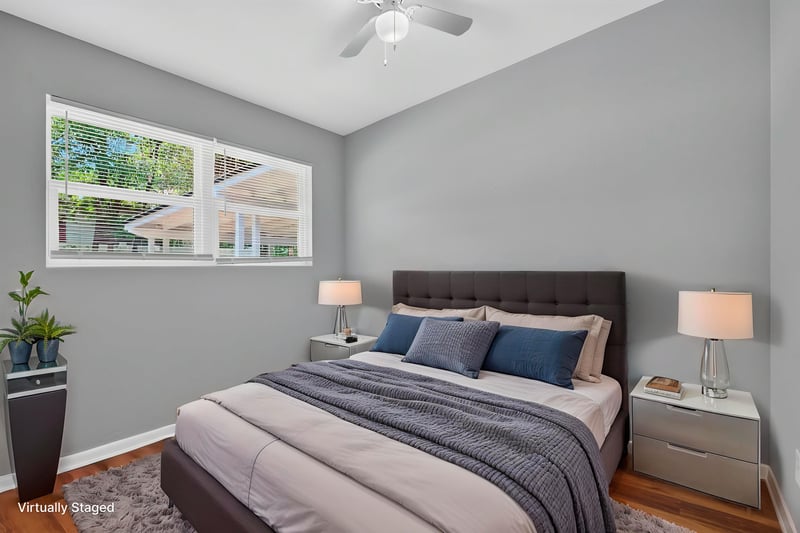 Bedroom with virtually staged bed and nightstands at 1928 Montmarte Dr, Jacksonville, FL 32210