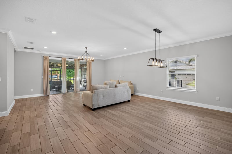 Living room with sliding doors to the screened porch at 91 Tilloo Ct, St. Johns, FL