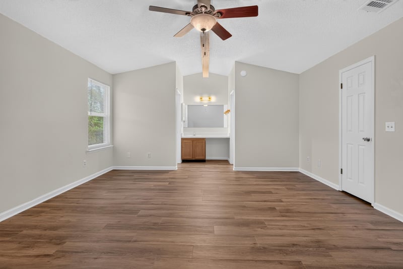 Empty room with ceiling fan and vaulted ceiling at 4427 Millstone Ct, Jacksonville, FL