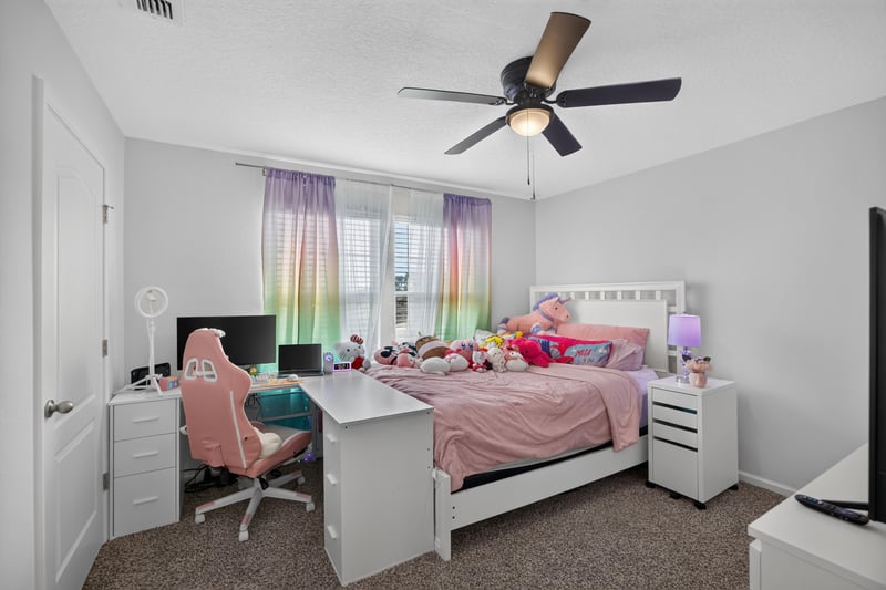 Bedroom with desk and chair at 65255 Frst Glen Ln, Yulee, FL 32097