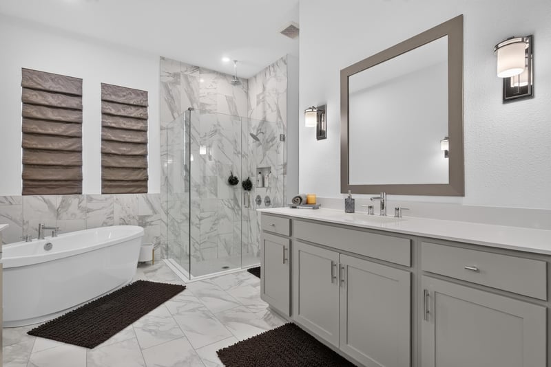 Primary bathroom soaking tub and marble-look tile at 785 Back Creek Dr, St. Augustine, FL 32092