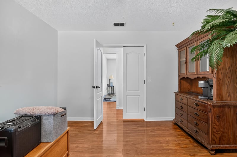 Hallway with dresser and storage at 2435 Range Line Rd, Middleburg, FL