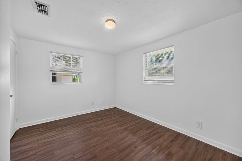 Empty room with two windows at 5812 Tampico Rd, Jacksonville, FL 32244
